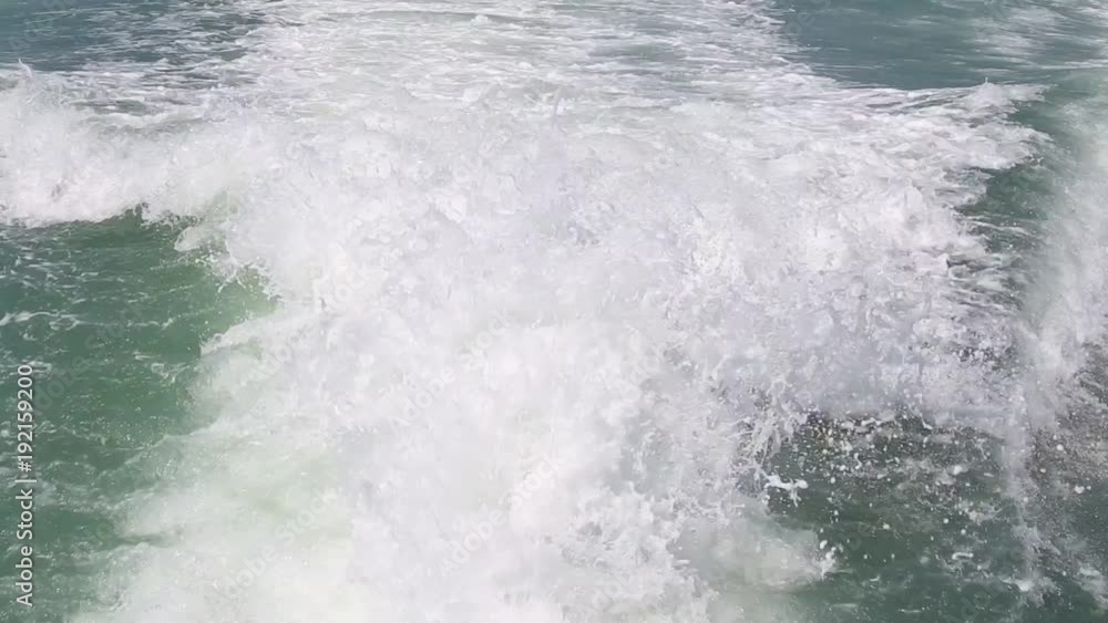 Blue ocean sea water wave with fast yacht boat wake foam of prop wash. Close up Blue ocean sea water wave with fast yacht boat wake foam of prop wash. Close up