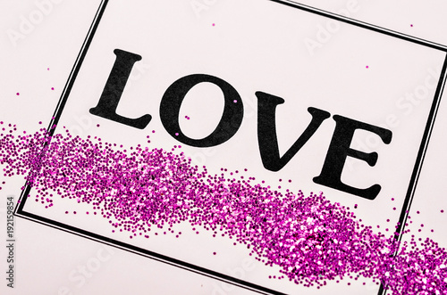 LOVE word with glitter in frame.