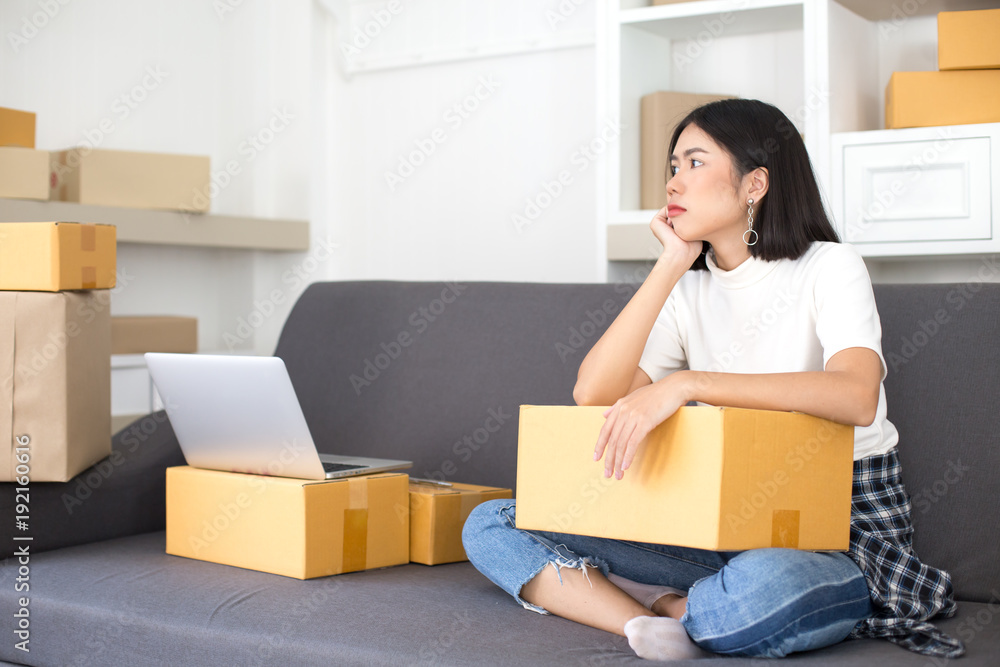 Asian woman with online business or online marketing. People with SME, Delivery, Online Business concept. Asian woman with online business or online marketing. People with SME, Delivery, Online Business concept.