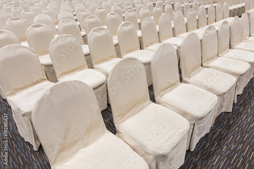 rows of empty grey seating at an event