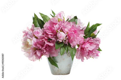 Bouquet of pink peonies in a vase isolated on white background.