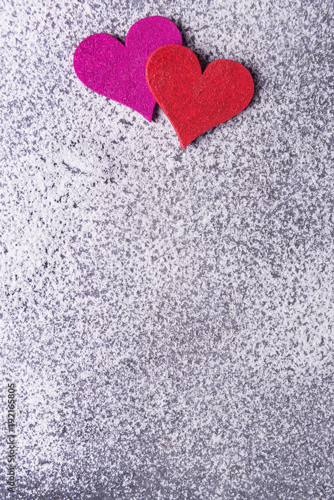 Pink and red hearts on Valentines day over snowy background. Pink and red hearts on Valentines day over snowy background.