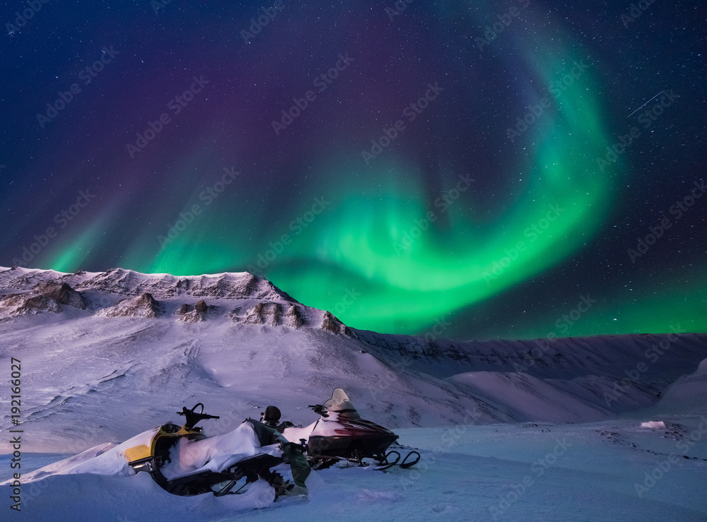 The polar arctic Northern lights aurora borealis sky star in Norway Svalbard  in Longyearbyen city snowscoter mountains Stock Photo | Adobe Stock