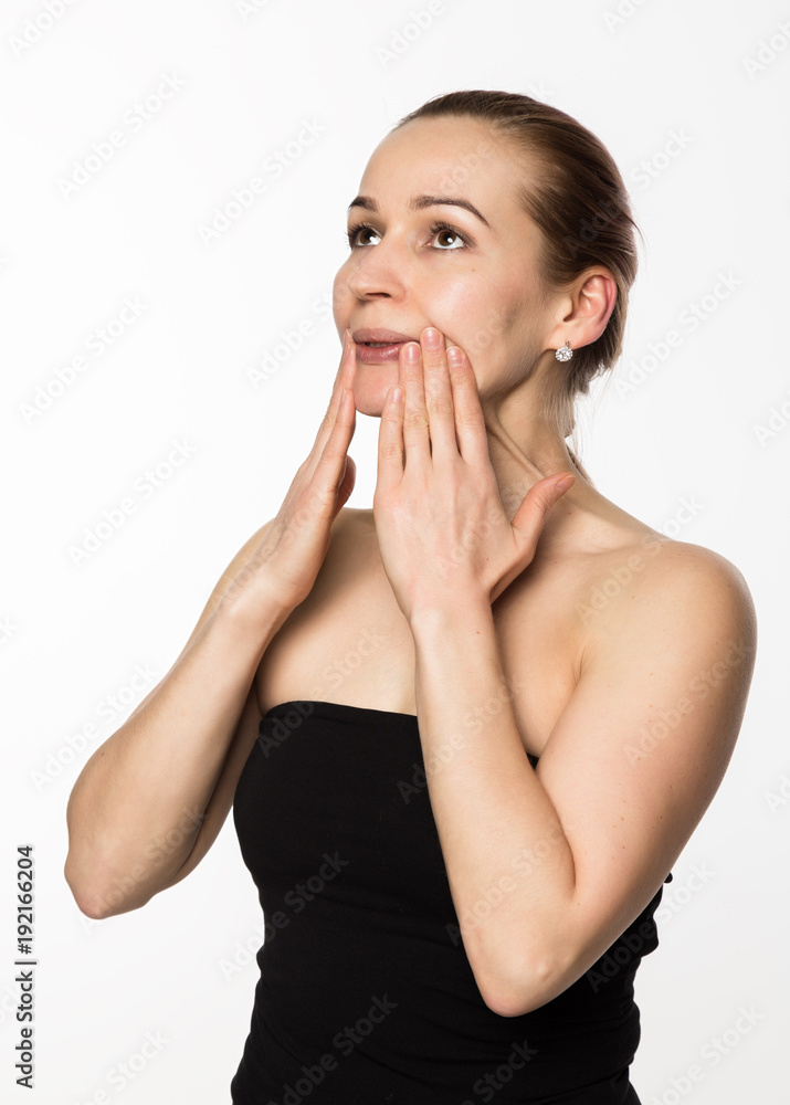 gymnastics for a face, woman doing anti-aging exercises. beauty and health concept gymnastics for a face, woman doing anti-aging exercises. beauty and health concept