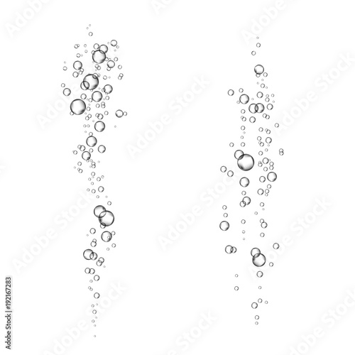  Underwater fizzing air bubbles stream on white background.