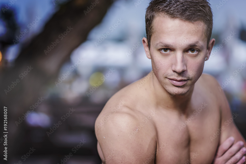 Young athletic caucasian man posing on the beach Young athletic caucasian man posing on the beach