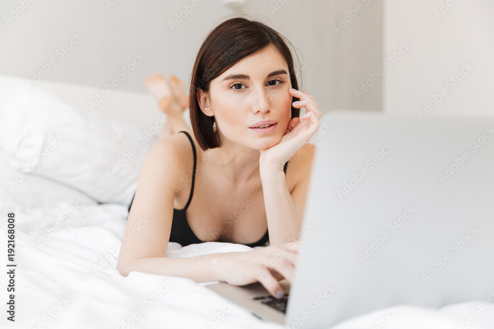Portrait of a beautiful young woman using laptop computer Portrait of a beautiful young woman using laptop computer