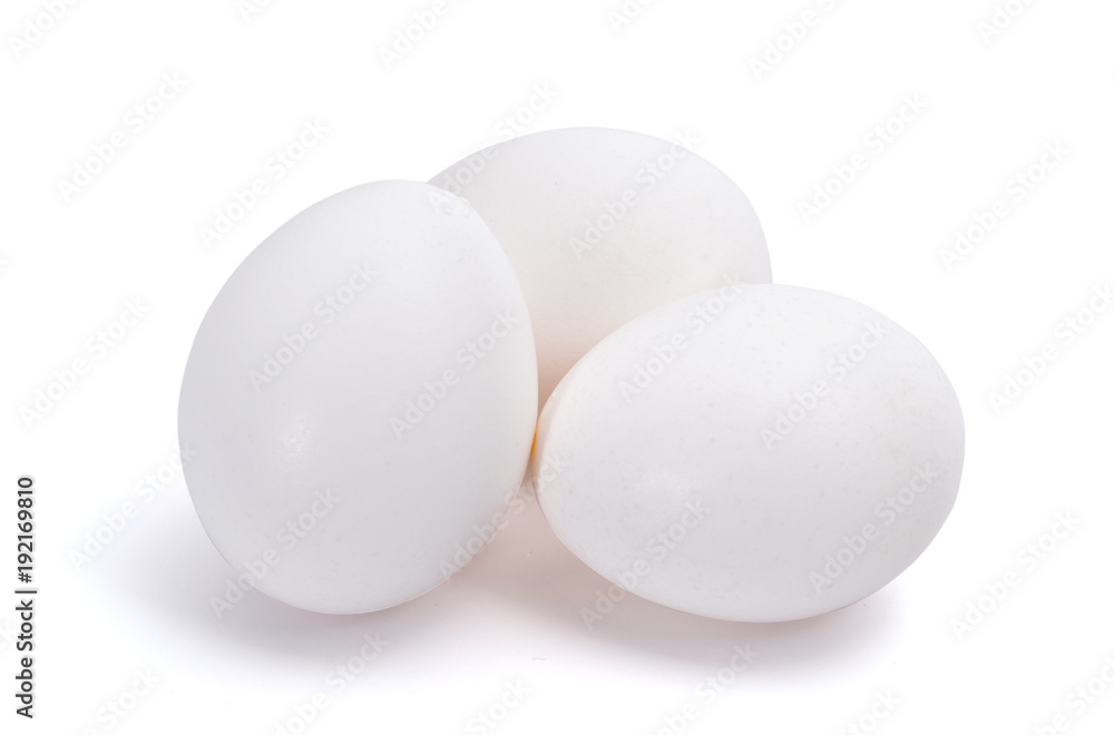 Group of three white eggs isolated on white background