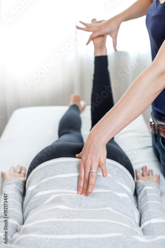 Therapist giving Kinesiology treatment.