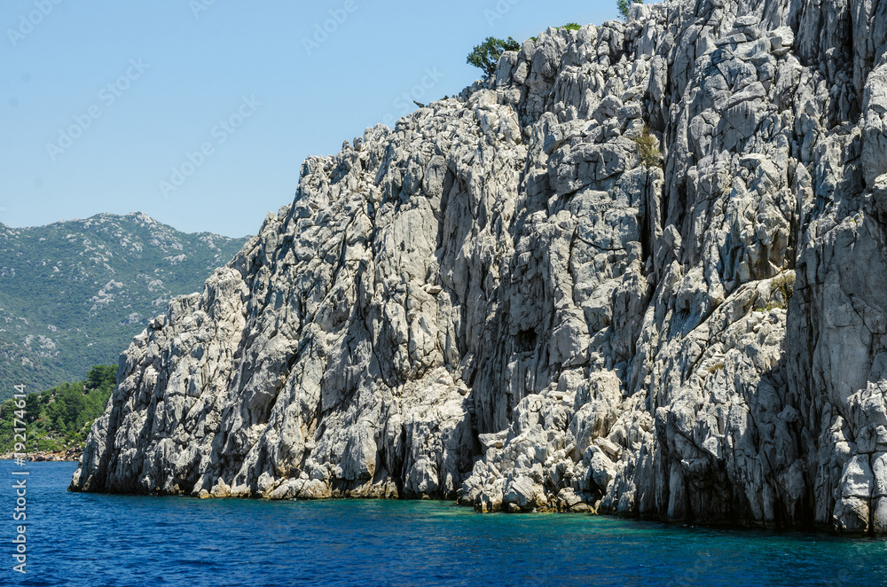 View rock island in Turkey Aegean Sea Rocky coast deserted near Marmaris Ichmeler summer holiday trip panorama landscape