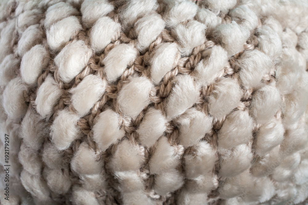 Convex pattern of structure of cloth knitting from yarn and natural sheep fur. Convex pattern of structure of cloth knitting from yarn and natural sheep fur.