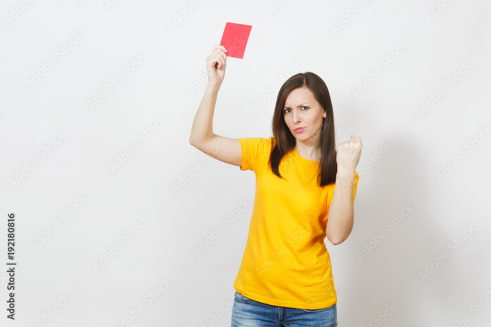 European serious severe young woman, football referee in yellow uniform show red soccer card, propose player retire from field isolated on white background. Sport, play, healthy lifestyle concept. European serious severe young woman, football referee in yellow uniform show red soccer card, propose player retire from field isolated on white background. Sport, play, healthy lifestyle concept.