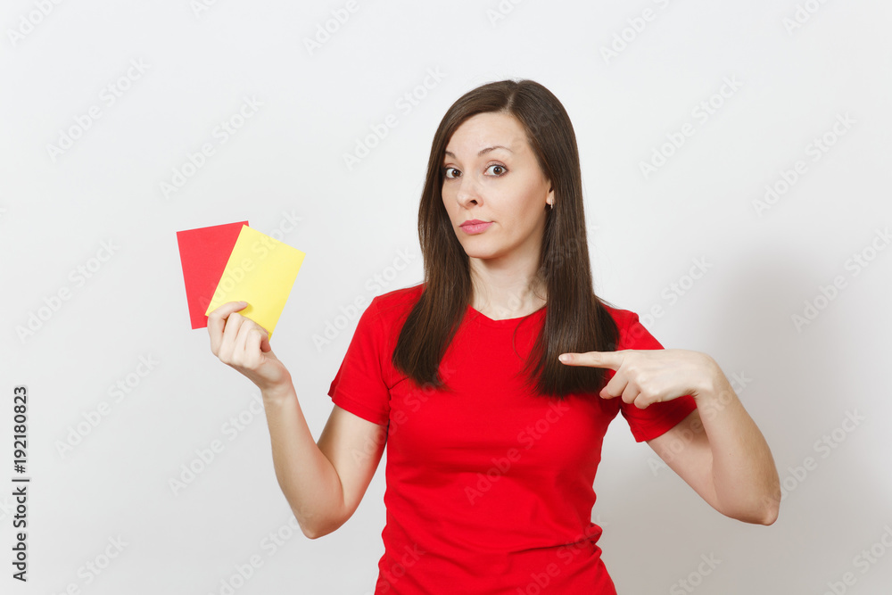 European serious severe young woman, football referee hold choose yellow and red soccer cards, propose player retire from field isolated on white background. Sport, play, healthy lifestyle concept.