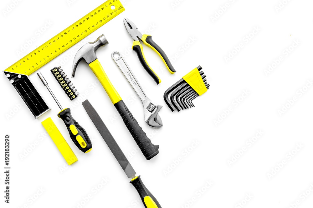 Various repair tools. Must-have for men. Equipment for building. White background top view copy space pattern Various repair tools. Must-have for men. Equipment for building. White background top view copy space pattern