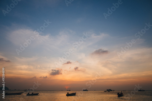 boats in harbour at sunset, Ko Tao island, Thailand photo
