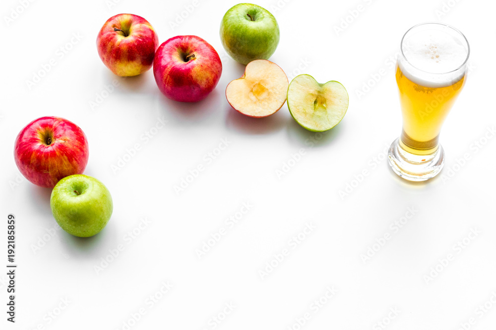 Apple cider poured into glass. White background top view copy space Apple cider poured into glass. White background top view copy space