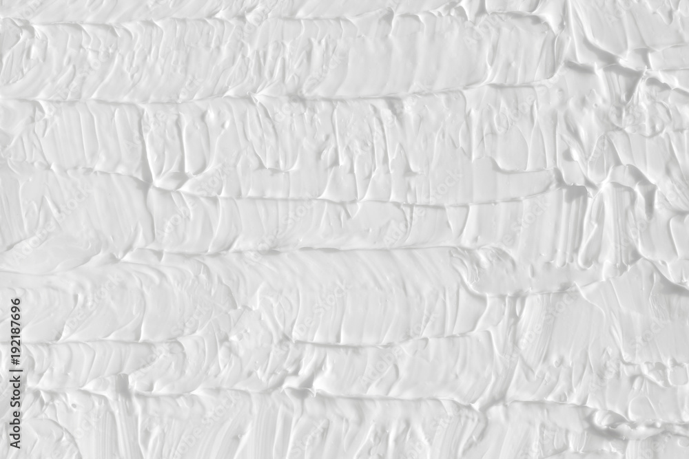 Texture of white with paint divorces, a template for the design of the room. The background is painted with brushes, handmade.