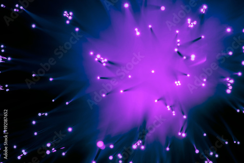 top view background of blurred glowing purple fiber optics