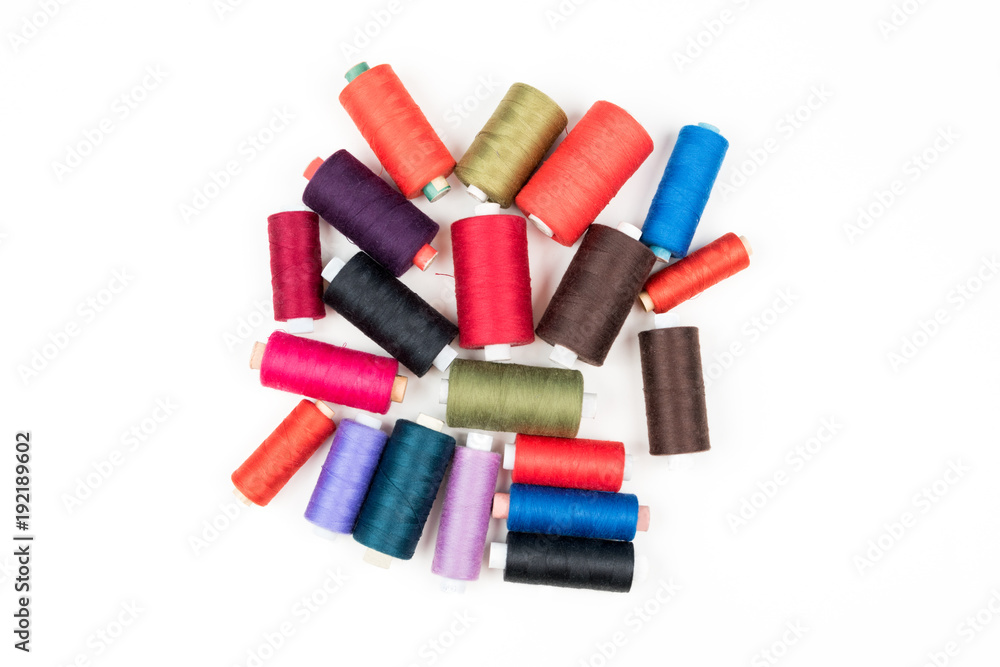 Set of colored thread coils on white background, sewing and tailoring Set of colored thread coils on white background, sewing and tailoring