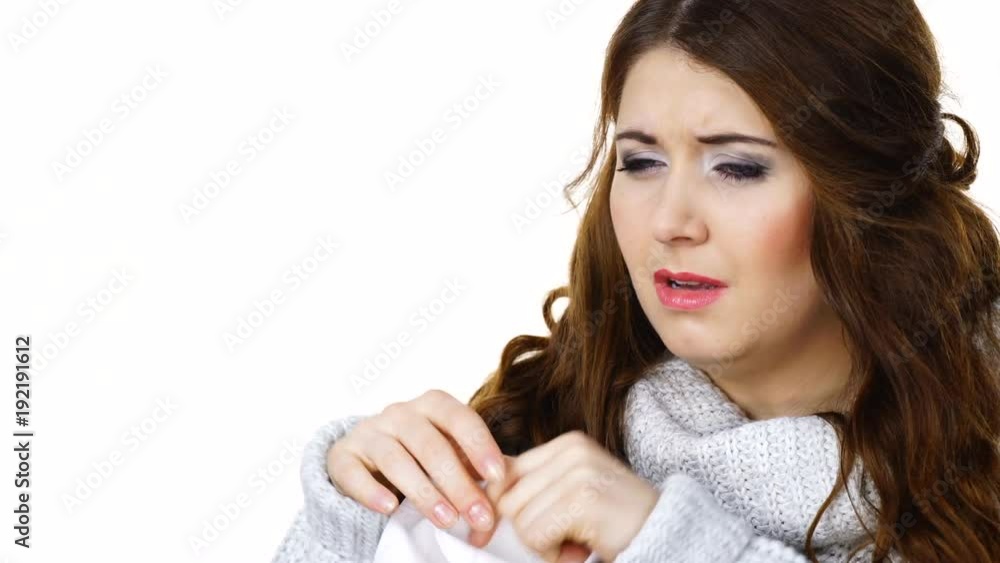 Sick freezing woman sneezing in tissue. Girl wearing warm sweater being cold and trembling. Seasonal diseases flu or other virus. Health care. Isolated. Sick freezing woman sneezing in tissue. Girl wearing warm sweater being cold and trembling. Seasonal diseases flu or other virus. Health care. Isolated.