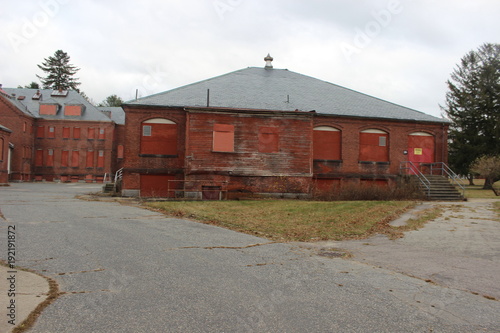 Abandoned brick asylum building © Alex