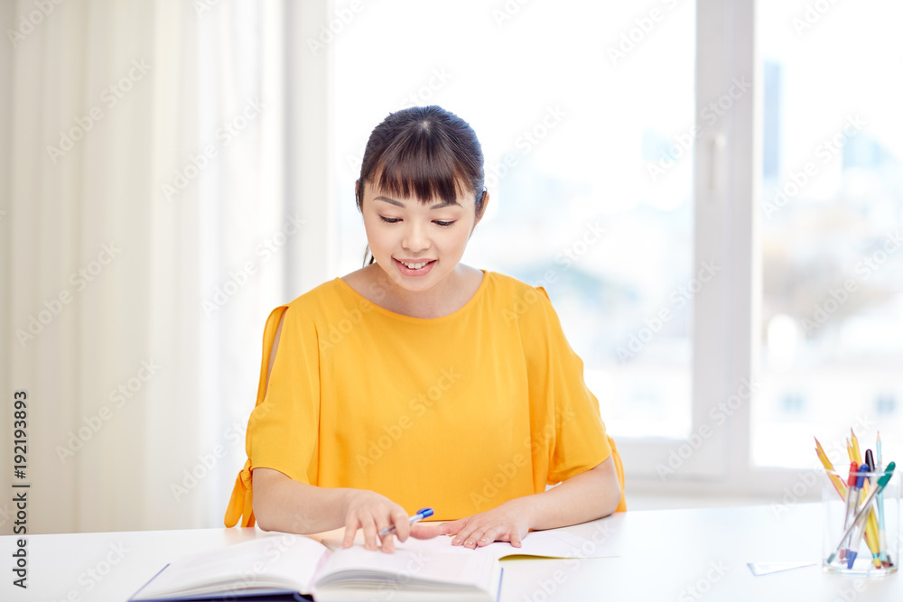 happy asian young woman student learning at home happy asian young woman student learning at home