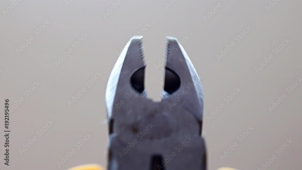 jaws of pliers open and closed, close up jaws of pliers open and closed, close up