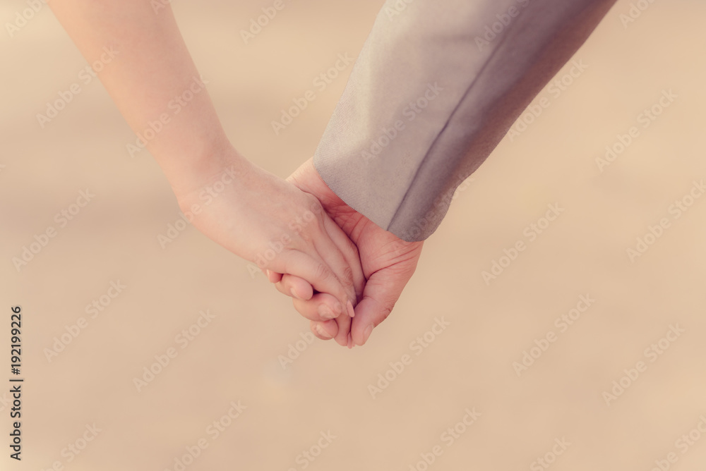 Couple holding hands in Valentine day
