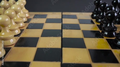 Stock footage wooden chessboard and chess pieces. Top view. photo