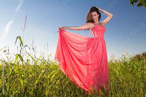 Young beautiful woman in the fields