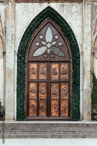 Entrance door of St. Joseph's Cathedral in the morning at Hanoi, Vietnam.
