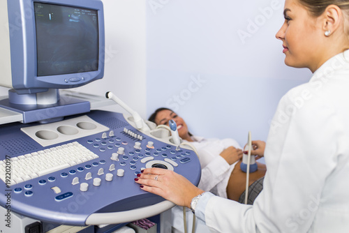 Young woman on ultrasound e...
