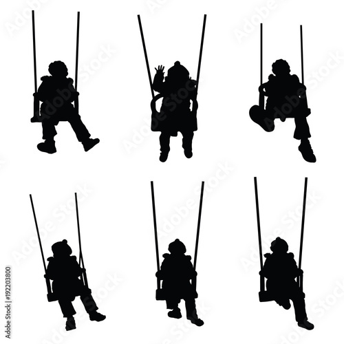 child silhouette on the swing is having fun