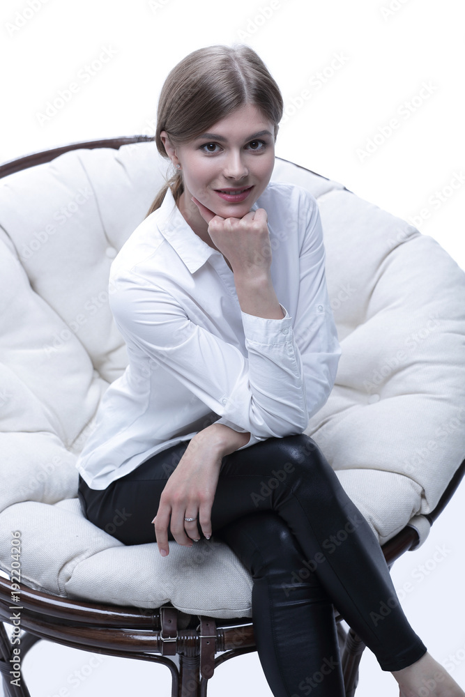 young business woman resting in a big soft chair young business woman resting in a big soft chair