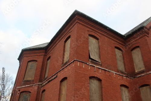 Abandoned brick asylum hospital building