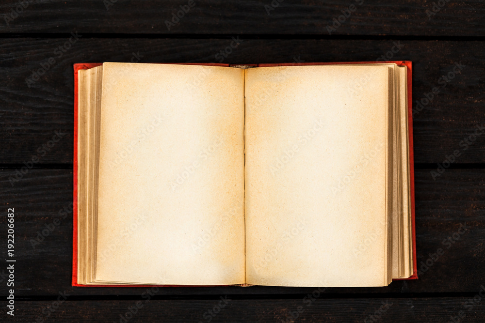 Naklejka premium Open book on dark background