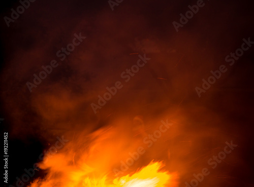 fire with smoke on a black background © schankz