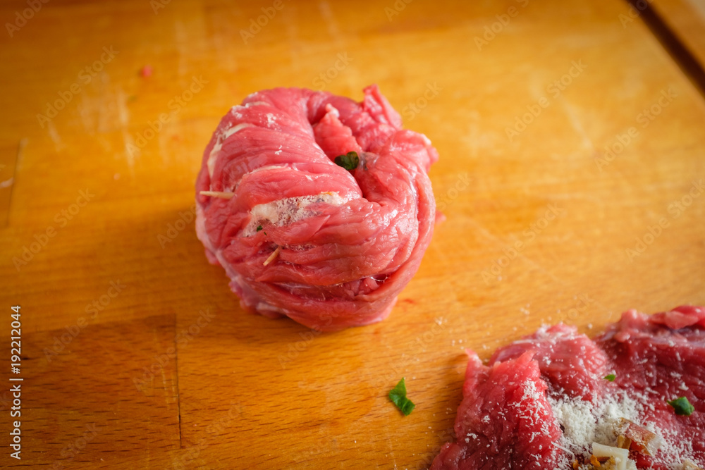 Making stuffed meat roll called braciola typical of Apulia region, Italy Making stuffed meat roll called braciola typical of Apulia region, Italy