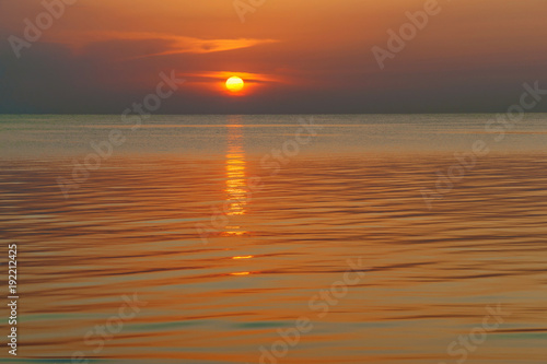 Sunset over the water with clouds. Sunset over the water..