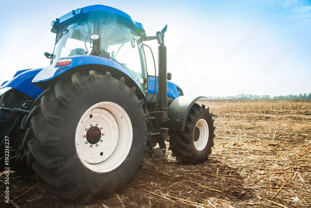 Blue tractor in a field Blue tractor in a field