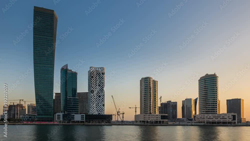 Sunset over embankment of Dubai Creek, Business bay at night. Dubai, UAE Sunset over embankment of Dubai Creek, Business bay at night. Dubai, UAE