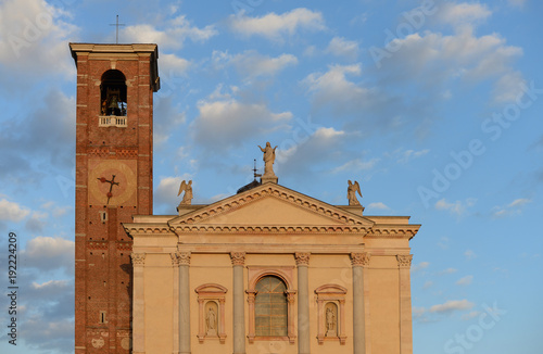 church of santa maria assunta with bell tower in the autumn evening sun in Gallarate, Varese, Italy