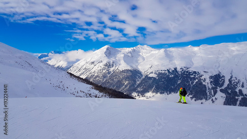 Winter holiday in the Alps mountains under blue sky