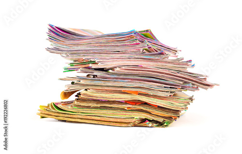 stack of colorful magazines isolated on white background