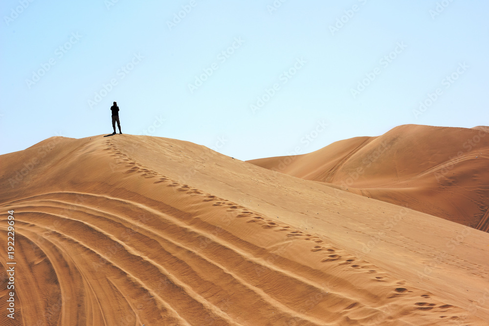 The man in Huacachina desert dunes The man in Huacachina desert dunes
