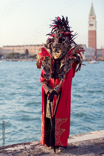 Strange looking red costume in front of Campanile di San Marco, Venice, Carnival