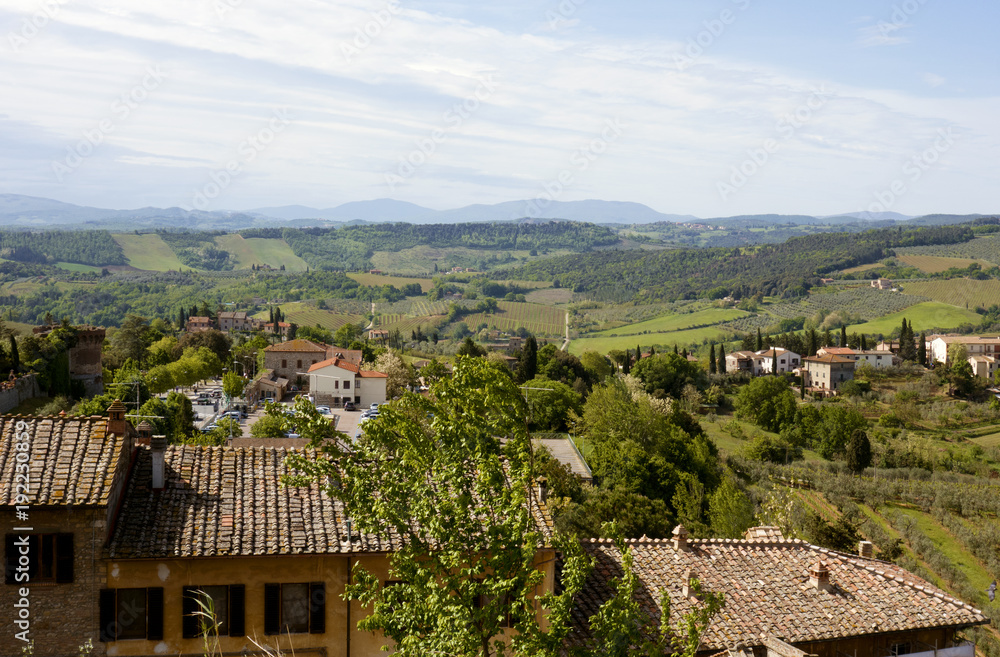 View of roofs and Tuscan landscape from Siena, Italy, 2017. View of roofs and Tuscan landscape from Siena, Italy, 2017.