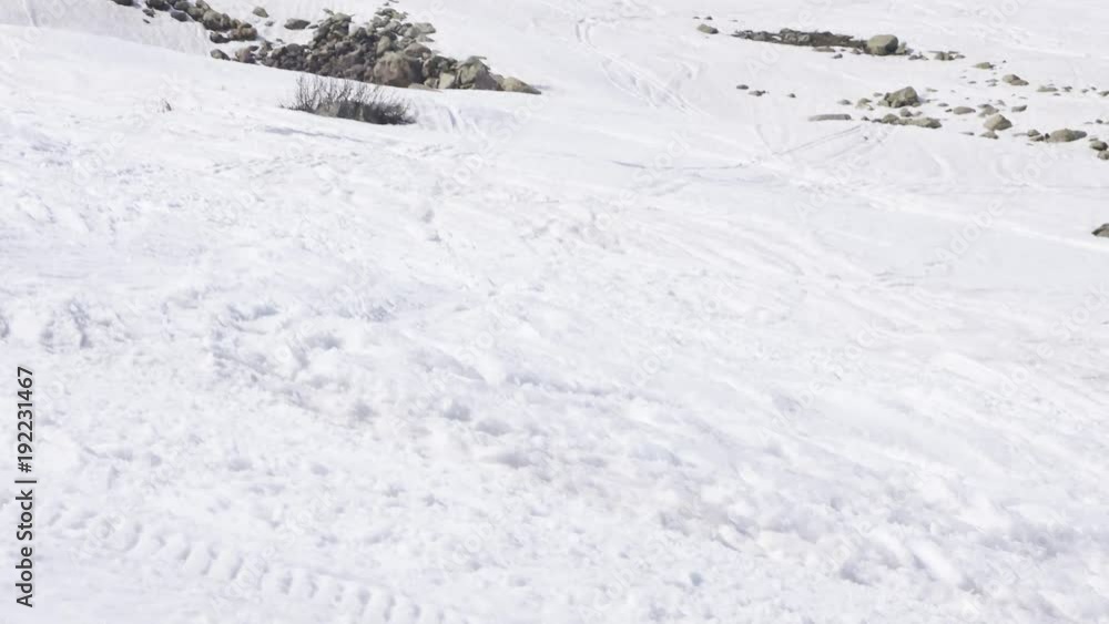 Pan right, skier soars off jump in Gulmarg Pan right, skier soars off jump in Gulmarg