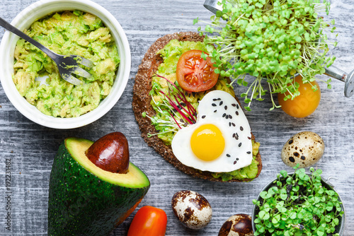 bruschetta with avocado microgrin, quail eggs and Adyghe cheese and mozzarella photo