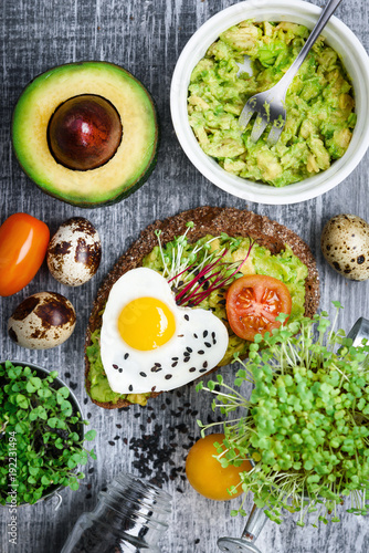 bruschetta with avocado microgrin, quail eggs and Adyghe cheese and mozzarella photo